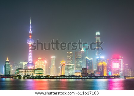 Shanghai evening city center skyline by the Huangpu River. China.