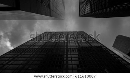 Bottom view at skyscrapers in black and white Royalty-Free Stock Photo #611618087