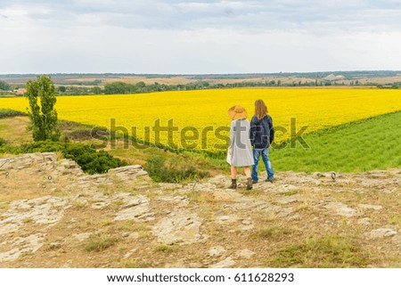 Young couple walk in nature back view