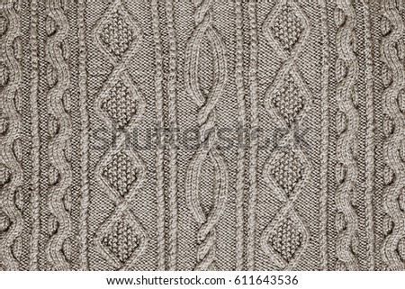 light beige background patterned knitted fabric closeup