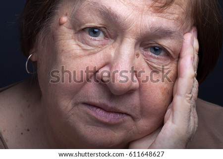 Portrait of elderly woman. Attention.