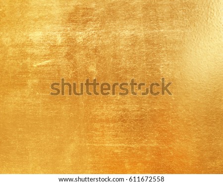 Shiny yellow leaf gold foil texture background Royalty-Free Stock Photo #611672558