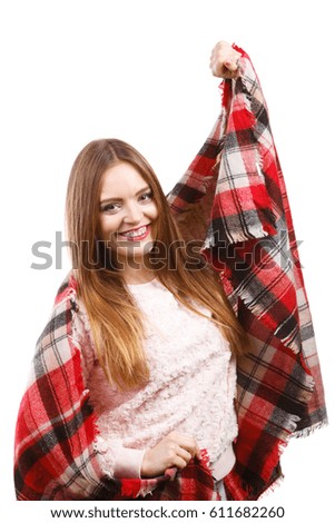 Autumn outfit accessories ideas concept. Woman having long straight hair wearing warm checked scarf warming herself up