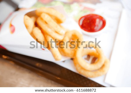 Picture blurred  for background abstract and can be illustration to article of Crunchy Fried Onion Rings with Ketchup