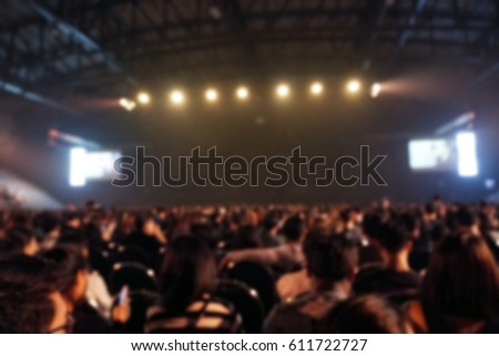 Blurred background : people watching concert