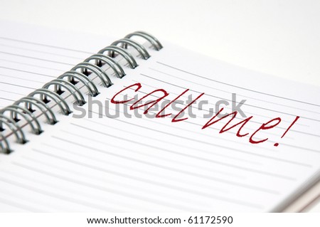 handwritten note in a notebook, close up image