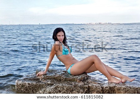 Girl on the rocky beach