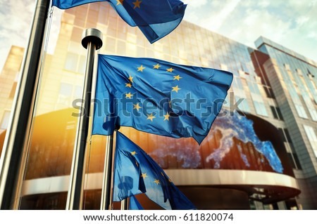 EU flags waving in front of European Parliament building. Brussels, Belgium Royalty-Free Stock Photo #611820074