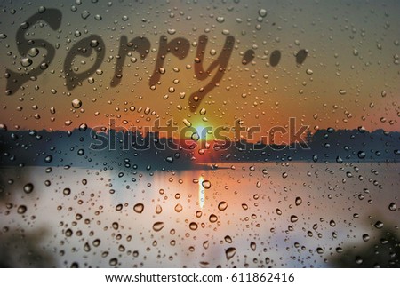 The inscription on the wet window "Sorry"
