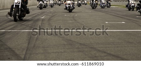 Harley motorcycle race in circuit, vehicle and transport Royalty-Free Stock Photo #611869010