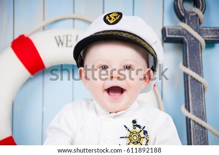 A small cheerful captain in a maritime interior