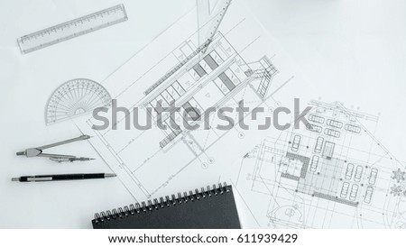 Construction equipment. Repair work. Drawings for building Architectural project, blueprint rolls and divider compass on table. Engineering tools concept with copy space
