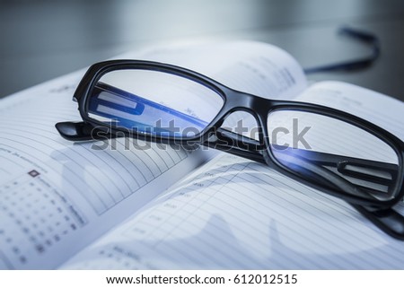 Rest for eyes, glasses on a notebook