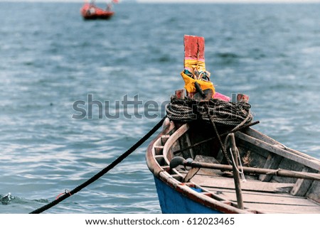 The Prow Image Of Wooden Boat On Water.
