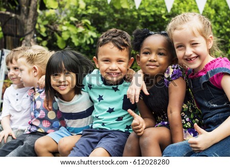 Group of kindergarten kids friends arm around sitting and smiling fun Royalty-Free Stock Photo #612028280