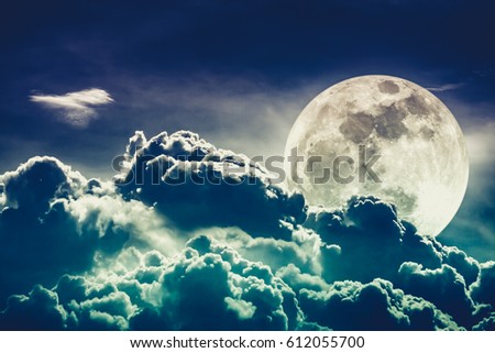 Background night sky with cloudy and super moon behind clouds. Cross process. The moon were NOT furnished by NASA.