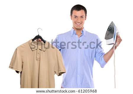Man holding a blue and white clothing iron and his T-shirt isolated on white background