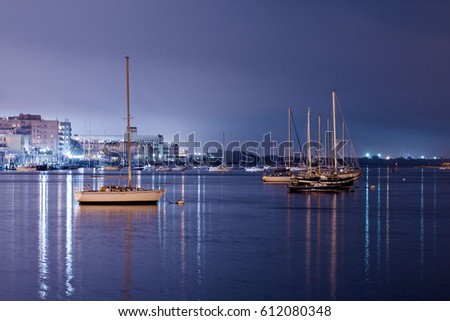 Luxury yacht in the port at night