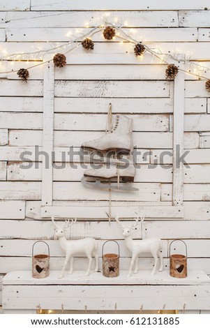 symmetrical pair of skates hanging on a white background rich wood