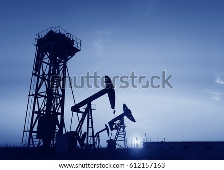 Pumping unit is working in oil field of the sunset 