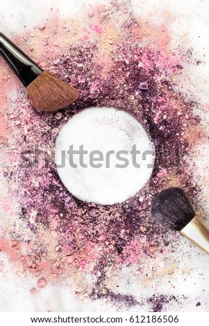 Makeup brush on white marble background, with traces of powder and blush forming a frame. A vertical template for a makeup artist's business card or flyer design, with copy space