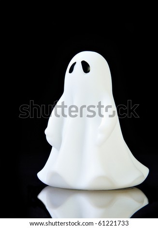 The perfect ghost on black background with reflection and copy space