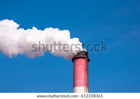 Smoke comes out of factory chimneys / environment and industry and air pollution, dust, smog, fine dust Royalty-Free Stock Photo #612238361