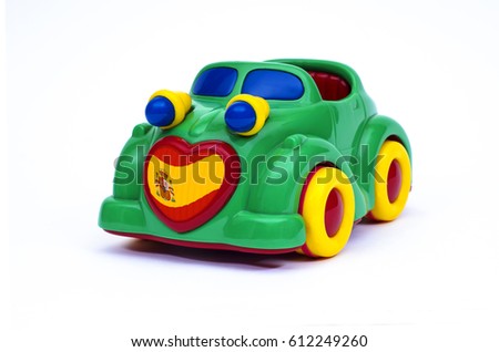Green, blue and yellow toy car with a spanish flag