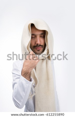 Guy with a mustache in a white suit. Corrects the scarf with your right hand. On a white background