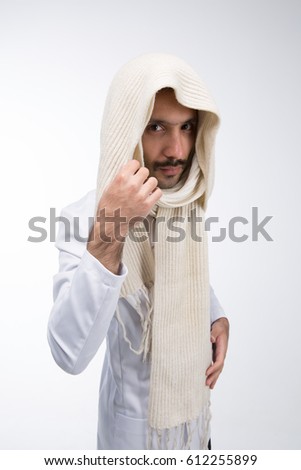 A Syrian guy with a mustache in a white suit. Holding the scarf with your right hand . On a white background