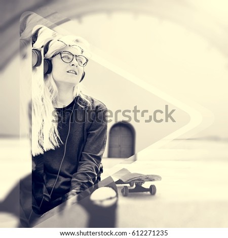 Young hipster woman listening playing skateboard