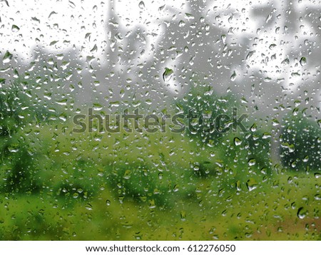 looking outside pass the mirror when having rain to see the raindrop and blurred background