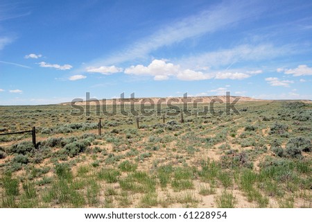 Desert Landscape with Fence and Blue Sky