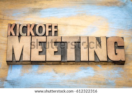 Kickoff meeting word abstract in letterpress wood type printing blocks against grunge wooden surface Royalty-Free Stock Photo #612322316