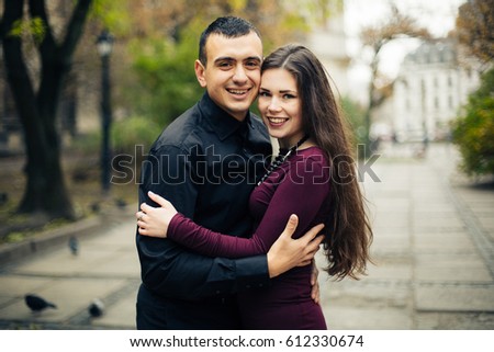 portrait of happy  couple posing in   city