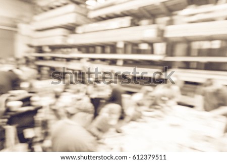 Blurred image children, parent participate craft workshop at warehouse, organized by home improvement retailer in America. Kid build, paint picture frame, toolbox, handmade art education. Vintage tone
