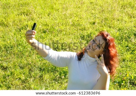 woman phoning in the nature