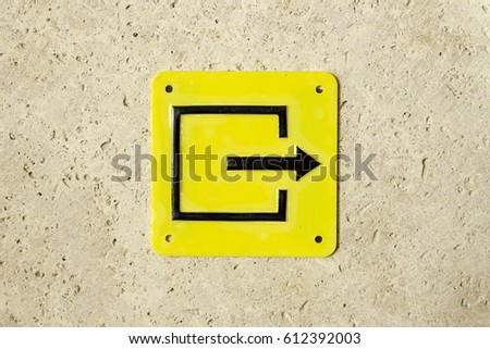 Yellow sign symbol evacuation pointer exit left