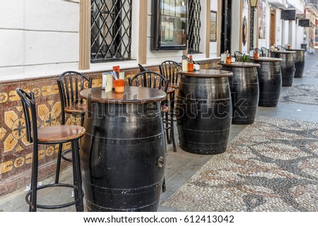 Typical Spanish bar with oak barrels on the outside, to take tapas and beers