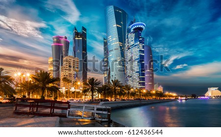 The skyline of Doha city center after sunset, Qatar Royalty-Free Stock Photo #612436544
