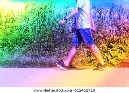 Active people walking in Alster park Hamburg Germany. Men and women walking outside in city on a sunny day in summer, colorful royal free image with filter for travel business, family blogs, leisure