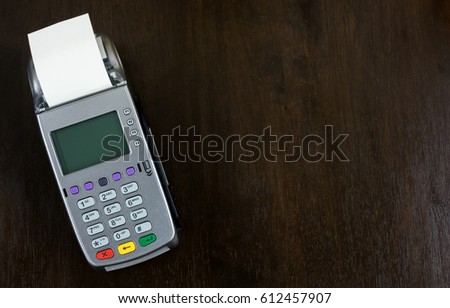 credit card terminal isolated on wood table background