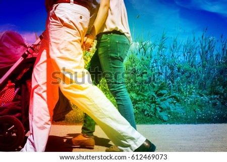 Active people walking in Alster park Hamburg Germany. Man and woman walking outside in city on a sunny day in summer, colorful royal free image with filter for travel business, family blogs, leisure