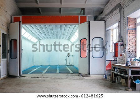 Open painting camera in a car repair station Royalty-Free Stock Photo #612481625
