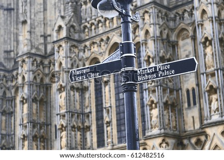 Facade of Wells Cathedral with signpost