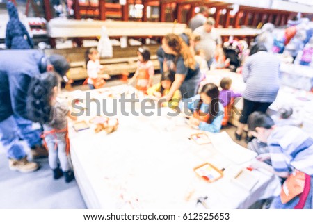Blurred image children, parent participate craft workshop at warehouse, organized by home improvement retailer in America. Kid build, paint picture frame, toolbox, handmade art education. Vintage tone