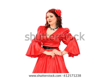 Beautiful gipsy lady in red dress posing 