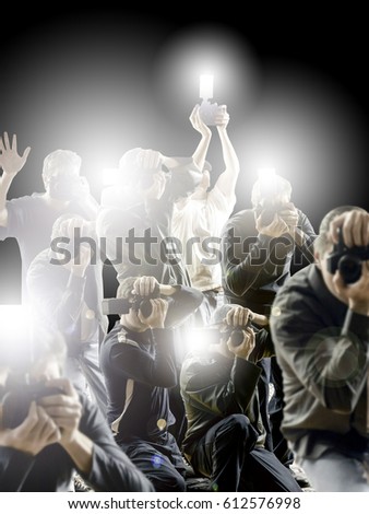 Camera flashing photographers, isolated against a black background