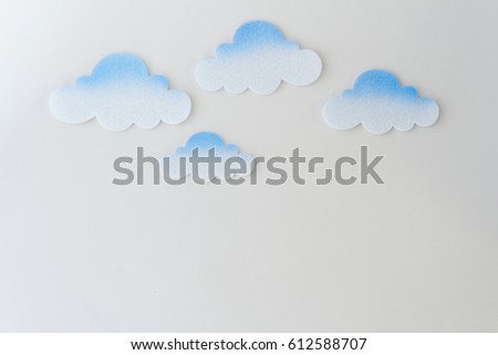 Cloud cut out made from thick paper on isolated background. Background and copy space.