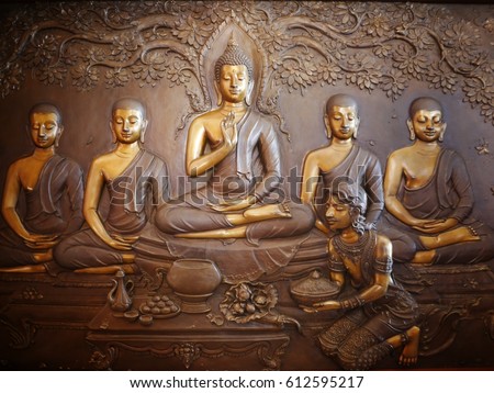 Buddha sculpture image. Asalha Puja Day. Buddhist All Saints' Day. Golden Buddha statue Royalty-Free Stock Photo #612595217